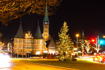 Nighttime view of Holsten Gate, Lübeck, Germany - Christmas time