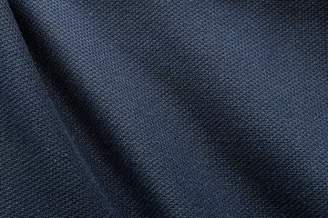 Badkamer foto achterwand Close up shot of midnight dark blue formal suit cloth textile surface. wool fabric texture for important luxury evening or night event. Wallpaper and background with copy space for text © BritCats Studio