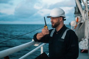 Marine Deck Officer or Chief mate on deck of offshore vessel or ship , wearing PPE personal...