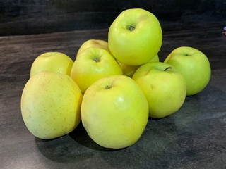 green apples on wooden table