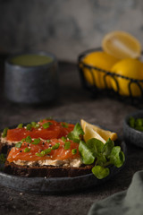 Fototapeta na wymiar cheese and salmon sandwiches, coffee matcha, breakfast concept