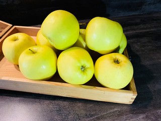green apples on wooden table