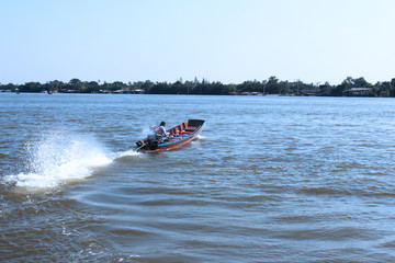 Fototapeta premium Long tail boat for urgent passenger transportation across the Chao Phraya River in Bangkok, Thailand