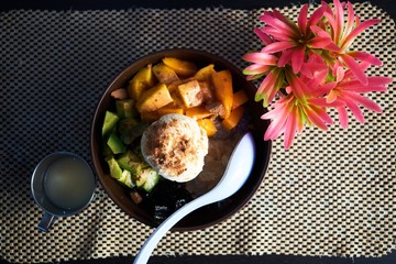 Bowl of fruid salad with ice cream