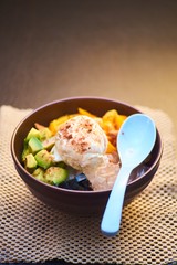Bowl of fruid salad with ice cream