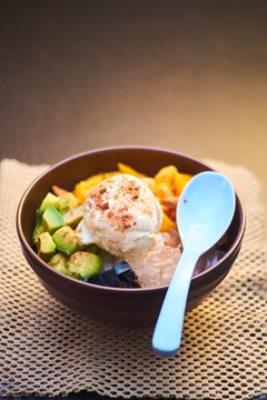 Bowl of fruid salad with ice cream