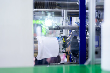 Manufacturing of plastic tank line, plastic tank hot blow injection process transportation raw material by automatic conveyor in the factory