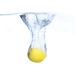 Lemons in the water with bubbles and splashes. Close-up. Isolated on white.Concept and idea with lemons