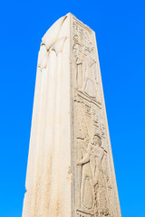 Granite obelisk against blue sky in a Karnak temple. Luxor, Egypt.