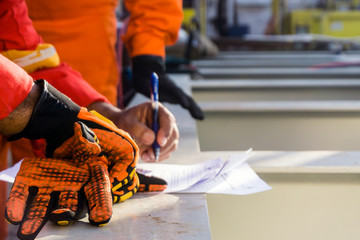 A supervisor signed a pre-job checklist on board a construction work barge prior to heavy lift...