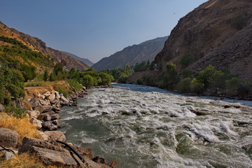 Fototapeta na wymiar Tajikistan. The Pamir highway near the border area with Afghanistan, the tributaries of the Panj river.