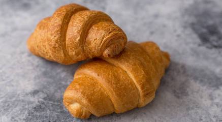 Freshly baked croissant delicious for breakfast with coffee.