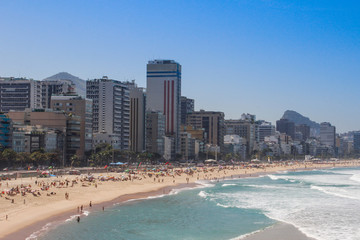 The most popular and famous beach of Brazil and Rio de Janeiro - Ipanema and Copacobana, relaxing on the beach among the rocks, sand and palm trees. The famous beaches 