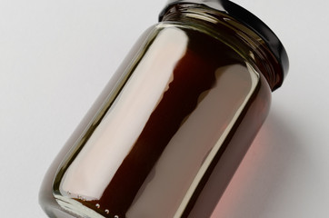 Honey jar mockup on a grey background. Closeup.