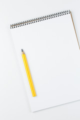 open notebook on white table top view