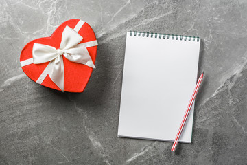 red box in shape of heart with notebook