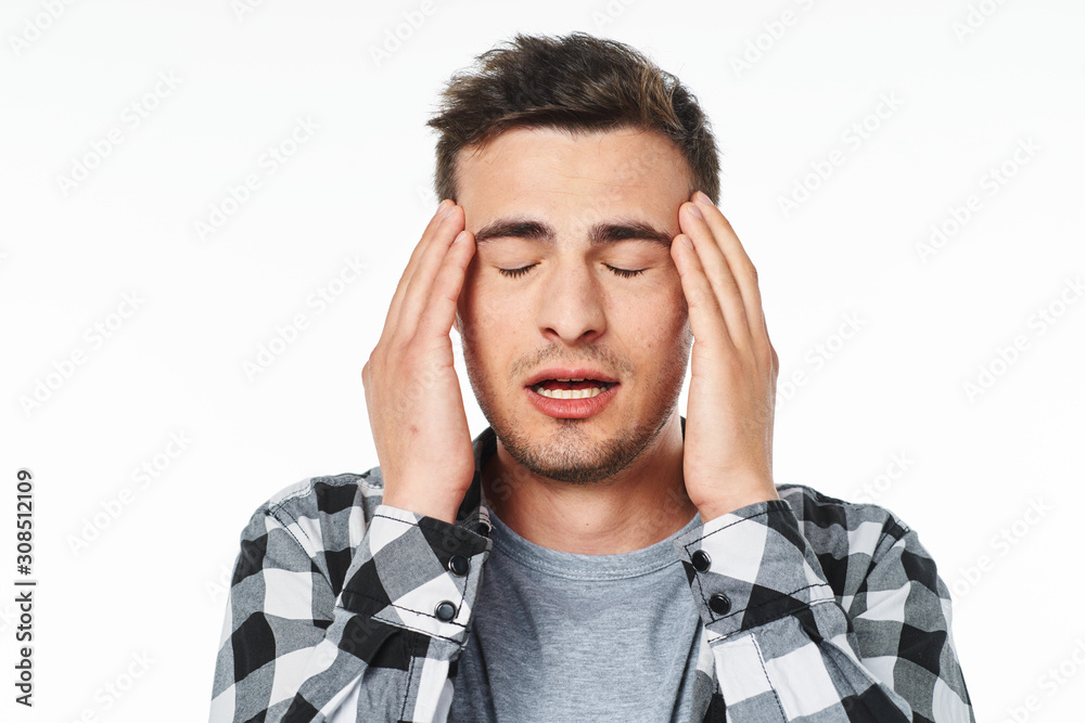 Wall mural portrait of young man with headache isolated on white