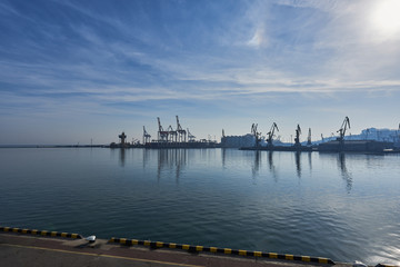 Cargo port cranes. Sea landscape.
