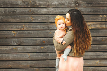 Portrait of happy loving mother and her baby outdoors