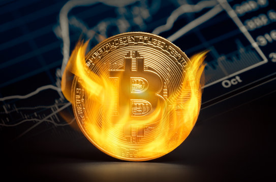 Golden bitcoin burning in flames