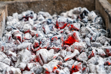 Close up and selective focus of flammable charcoal in fire red.