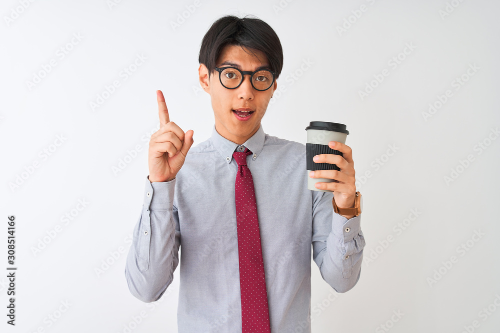 Wall mural Chinese businessman wearing tie and glasses drinking coffee over isolated white background surprised with an idea or question pointing finger with happy face, number one