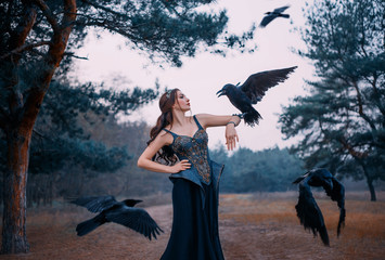 Beautiful woman with birds. Imperious strong power witch called her dark servants ravens. Queen in...