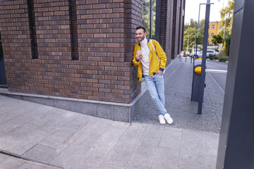 Kind student standing near business center alone