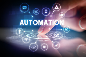 Finger touching tablet with web technology icons and AUTOMATION inscription, web technology concept