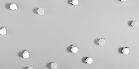 Christmas modern composition. Xmas white decorations on gray background. New Year, winter concept. Flat lay, top view, copy space