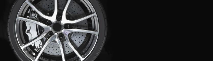 Alloy wheel with disk brake and calliper of modern luxury sport car.
