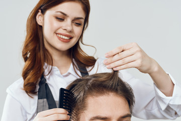 Naklejka premium portrait of young woman applying makeup