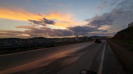 driving on highway at sunset