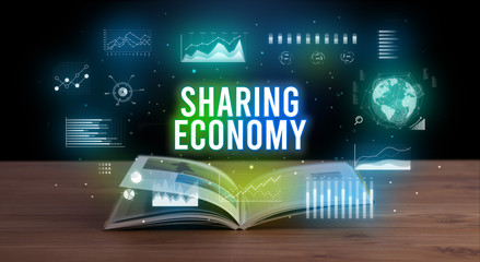 SHARING ECONOMY inscription coming out from an open book, creative business concept