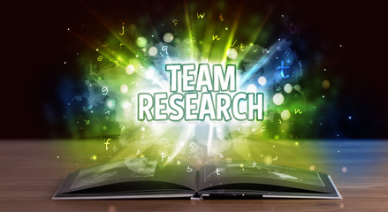 TEAM RESEARCH inscription coming out from an open book, educational concept