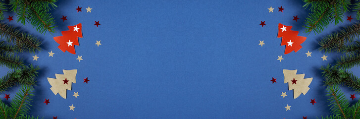 Christmas banner with Xmas tree and stars handmade on blue background with copy space.