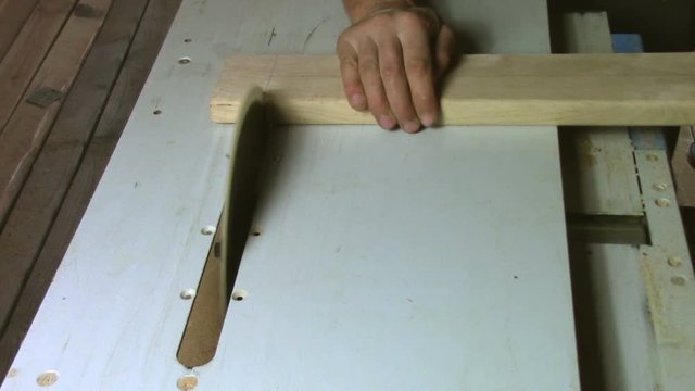 In carpentry stodio workplace. Wood processing woodworking close-up. Process of creating  handmade wooden product.