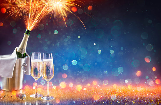 New Year Celebration With Champagne And Fireworks Popping In Bottle  - Colors Trend 2020
