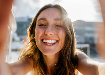 Close up of woman taking selfie outdoors