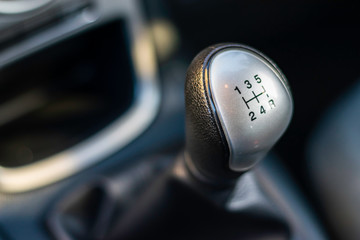 Gear level for a manual transmission vehicle, showing gears one through to five including reverse. ...