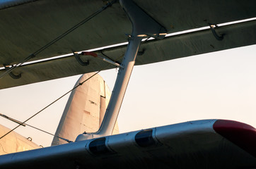 wings of an old airplane against a blue sky