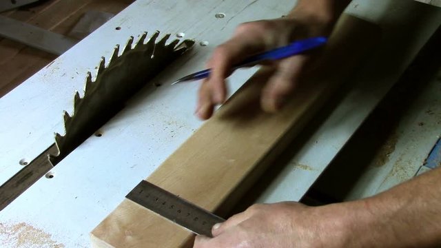 In carpentry stodio workplace. Wood processing woodworking close-up. Process of creating  handmade wooden product.