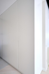wardrobe with white matte facades in the dressing room