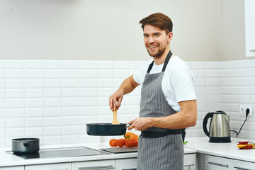 man preparing food in the kitchen