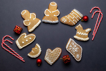 Gingerbread man. Xmas homemade Ginger, Honey cookies on dark background. Merry Christmas greeting card, banner. Winter holiday xmas theme. Happy New Year. Space for text