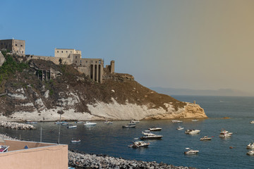 Panoramic view of beautiful Procida on a sunny summer day. Colorful cafes, houses and restaurants,...