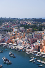 Panoramic view of beautiful Procida on a sunny summer day. Colorful cafes, houses and restaurants,...