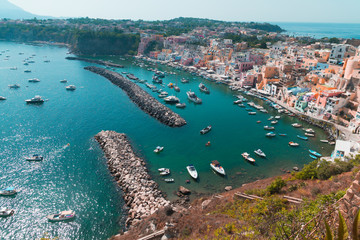 Panoramic view of beautiful Procida on a sunny summer day. Colorful cafes, houses and restaurants,...