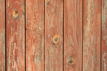 Old grey brown wooden planks with red cracked paint texture background