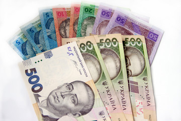 Ukrainian money hryvnia on the white background. The national currency. 5, 10, 20, 50, 500 bill or banknote. Corruption in Ukraine